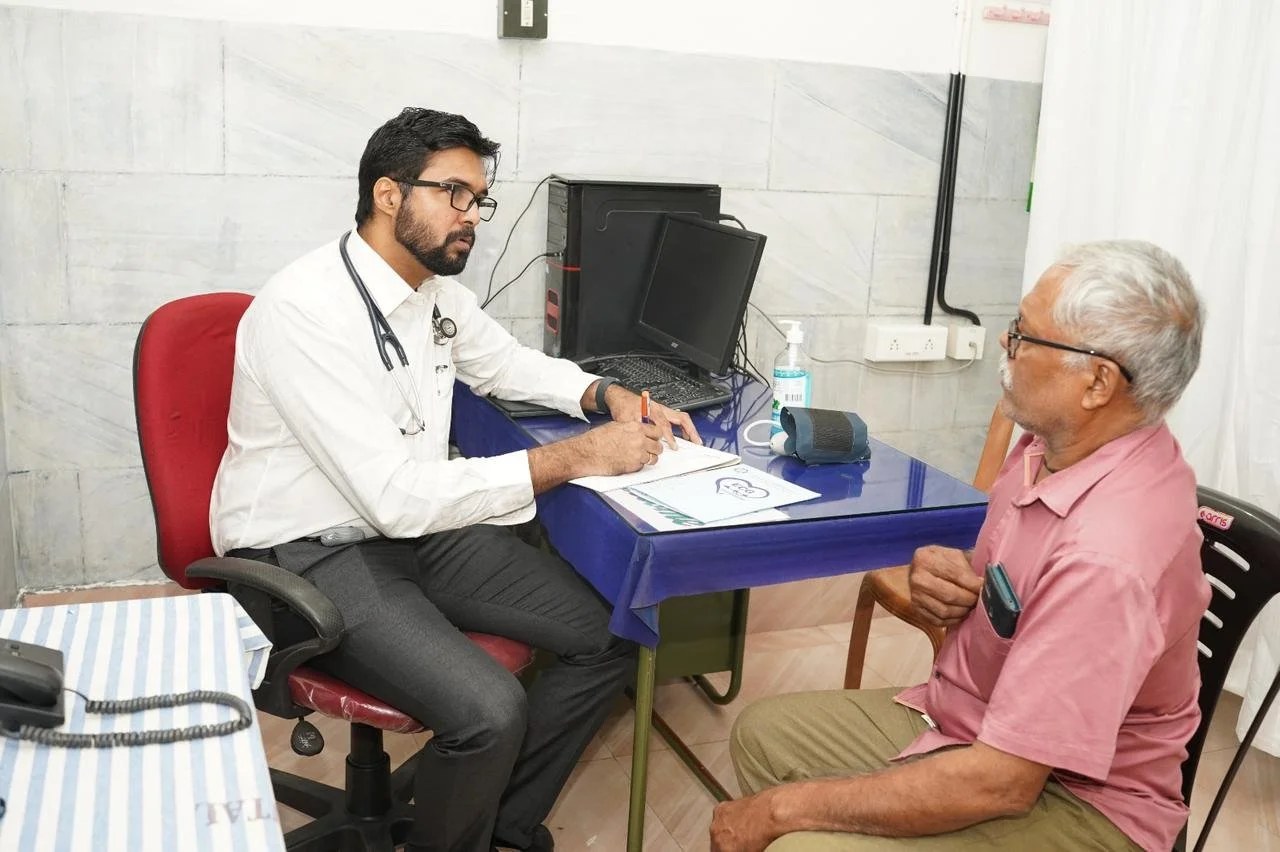 Health camp attendees receiving free screenings